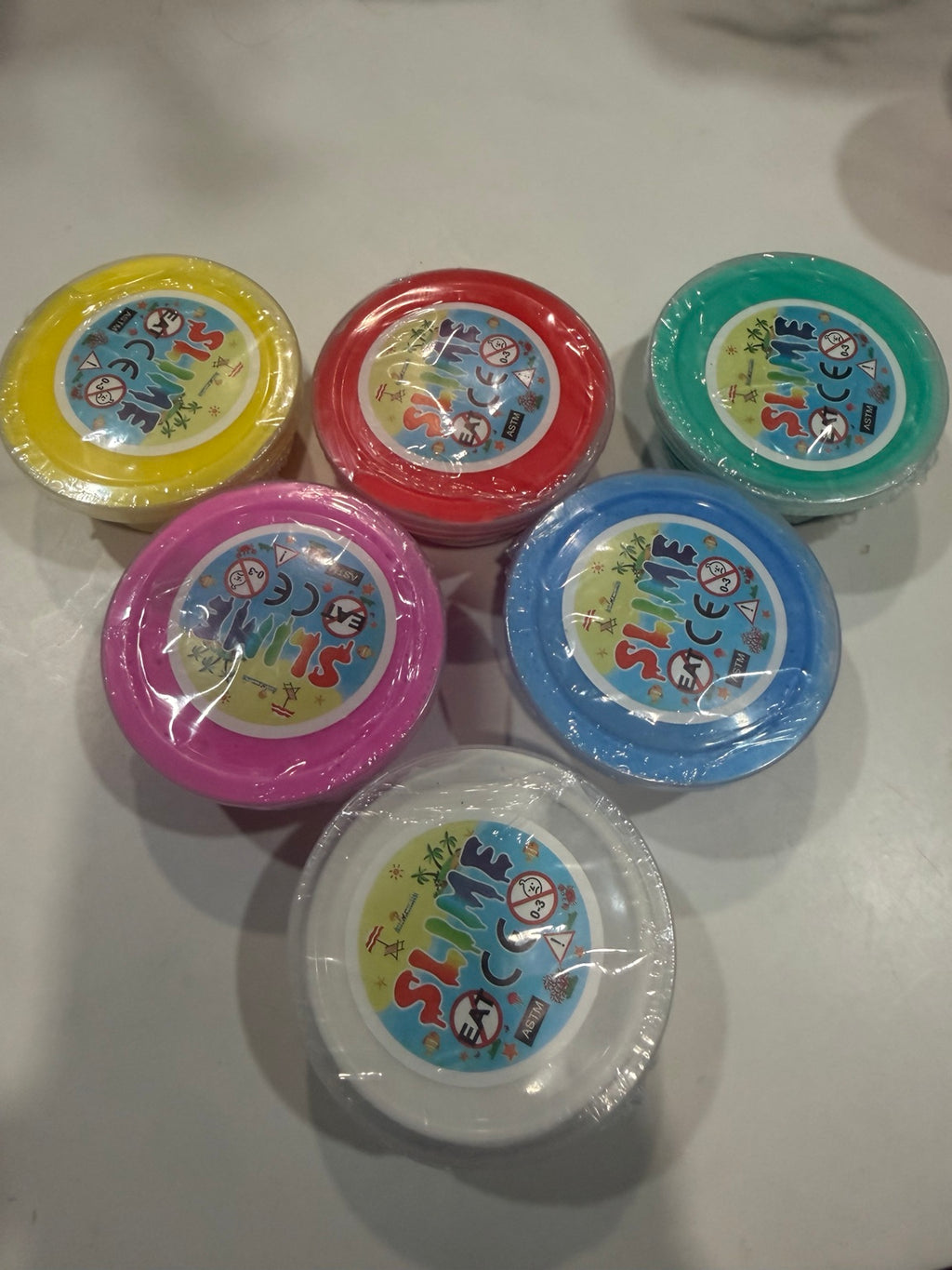 Assorted 2 oz slime cups in multiple bright colors