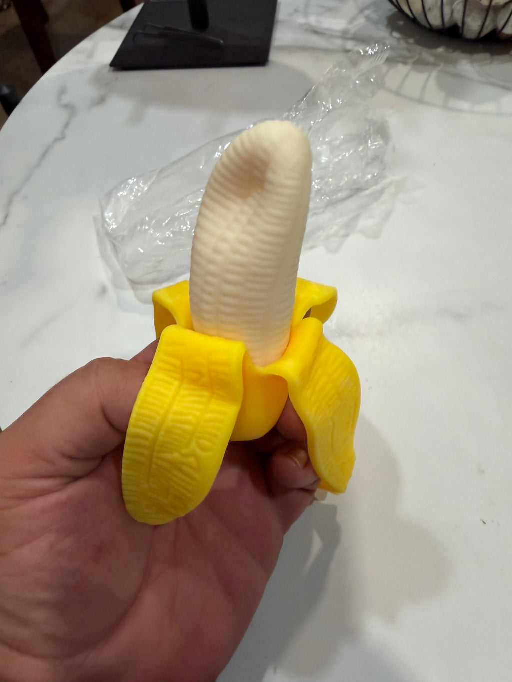 Peeled banana squishy with yellow peel and cream center