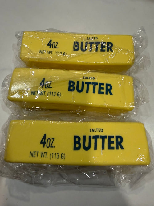 Three yellow butter stick squishy toys