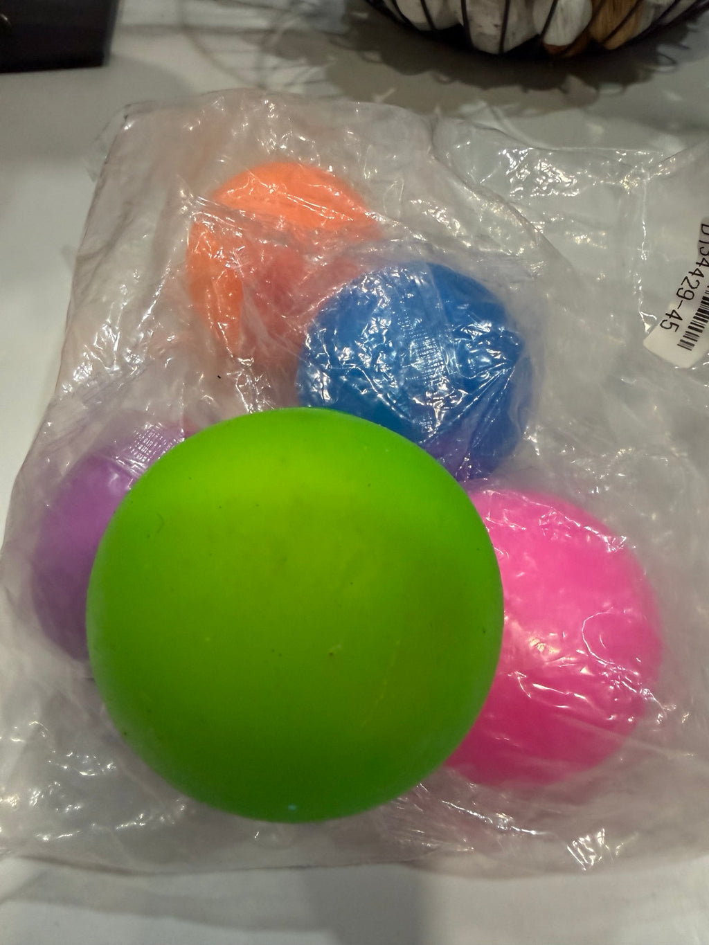 Assorted colorful round squishy balls in green, pink, purple, blue and orange