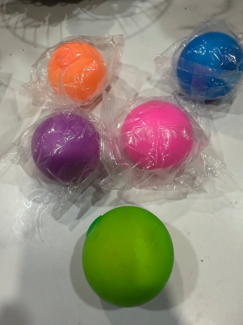 Colorful round squishy balls in orange, blue, purple, pink and green