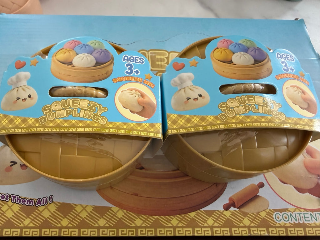 Pastel mystery dumpling squishies in steamer containers