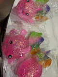 Pink glitter fish squishy with rainbow tail